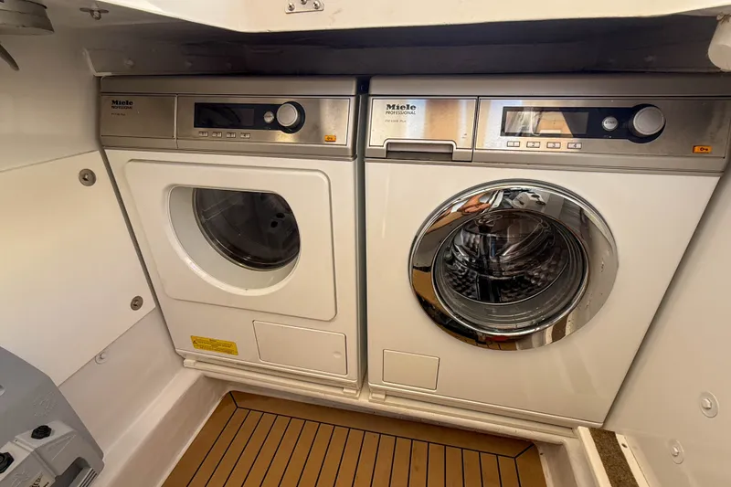 Slide: The Image of Laundry appliances on MJM 50z yacht, 2017 model, featuring Miele washer and dryer. - 57