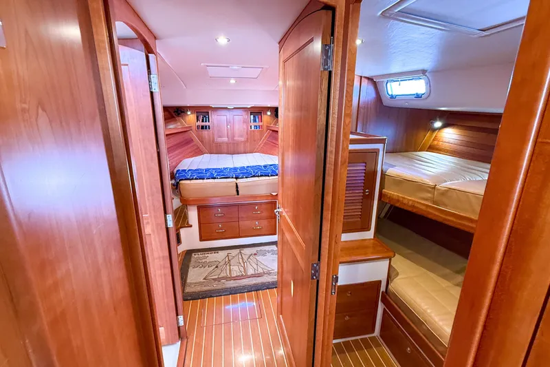 Slide: The Image of Luxurious 2017 MJM 50z yacht interior with wood finish and cozy sleeping quarters. - 35