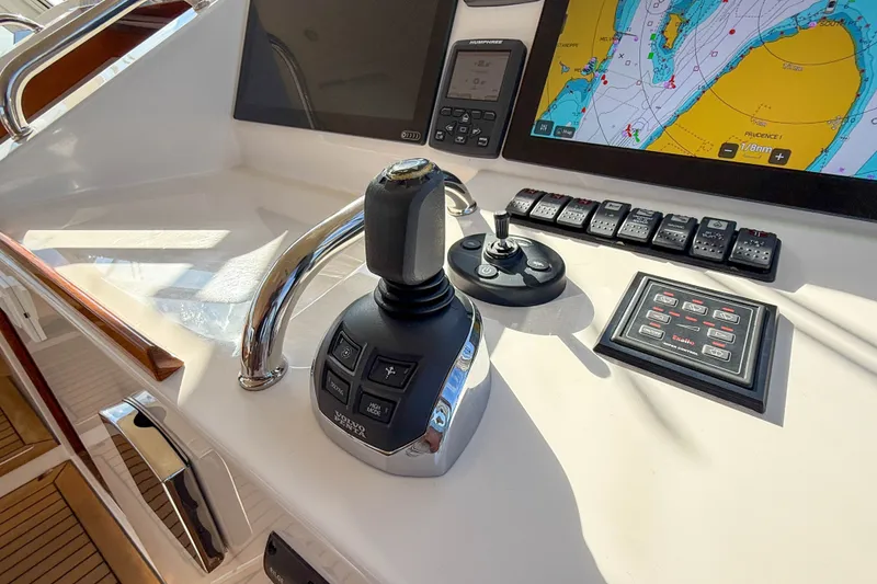 Slide: The Image of Control panel of a 2017 MJM 50z yacht with navigation and joystick controls. - 25