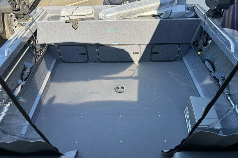 Slide: The Image of Interior of 2025 Duckworth 20 Advantage boat, showcasing spacious deck and storage compartments. - 24