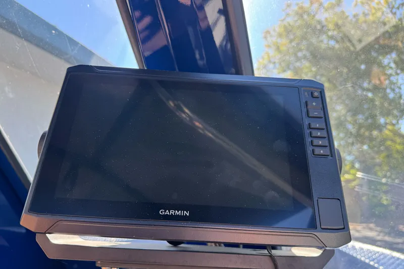 Slide: The Image of Garmin device inside 2025 Duckworth 20 Advantage boat, mounted on dashboard. - 19