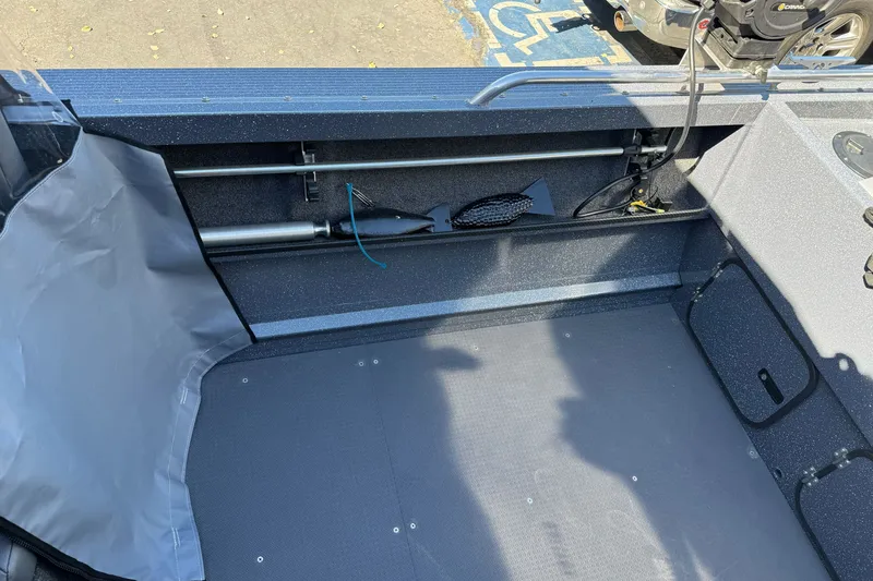 Slide: The Image of Interior of a 2025 Duckworth 20 Advantage boat showing storage and equipment. - 25