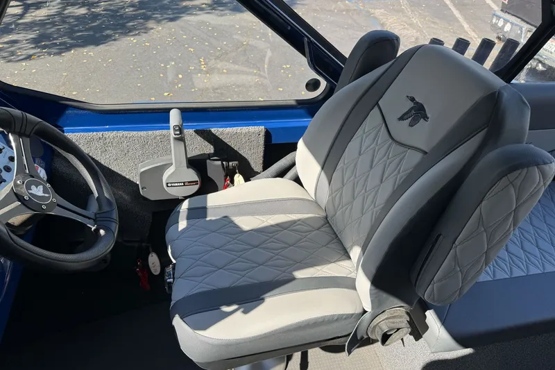 Slide: The Image of Interior of 2025 Duckworth 20 Advantage boat with steering wheel and Yamaha controls. - 20
