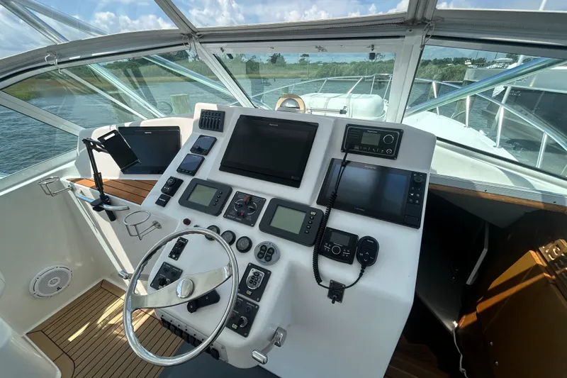 Slide: The Image of Helm of 2006 Topaz 40 Express boat with navigation equipment and steering wheel. - 17