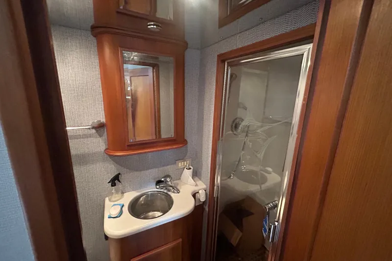 Slide: The Image of Bathroom interior of 2006 Topaz 40 Express yacht with sink and shower. - 34