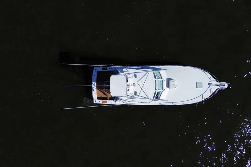 Slide: The Image of Aerial view of 2006 Topaz 40 Express yacht on dark water. - 13