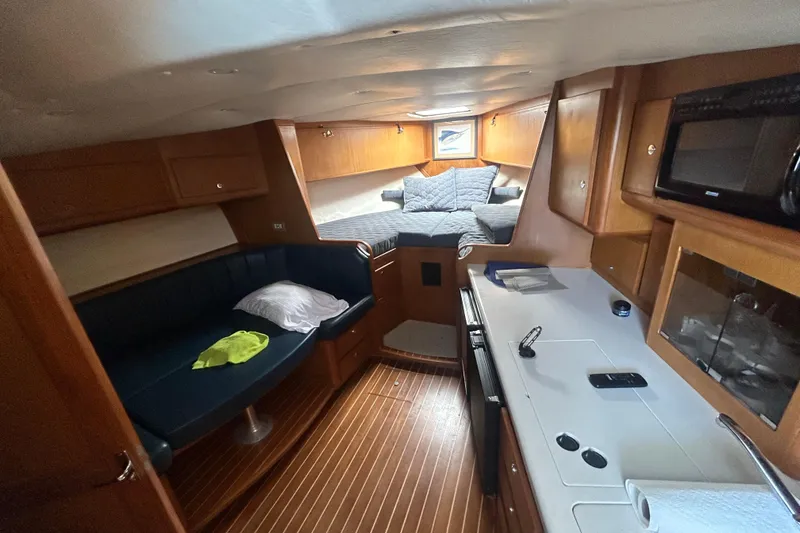 Slide: The Image of Interior of 2006 Topaz 40 Express yacht with cozy seating and modern amenities. - 30