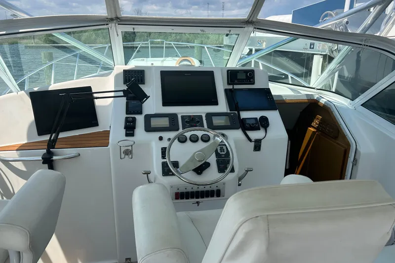 Slide: The Image of Helm of 2006 Topaz 40 Express boat with modern navigation equipment. - 15