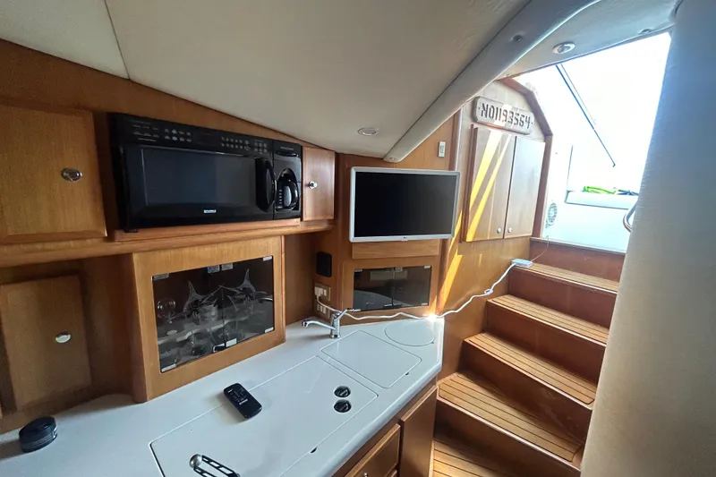 Slide: The Image of Interior of 2006 Topaz 40 Express yacht with kitchen and stairs. - 40