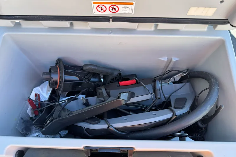 Slide: The Image of Storage compartment of a 2021 Sea-Doo RXT-X 300 with various equipment and accessories. - 16