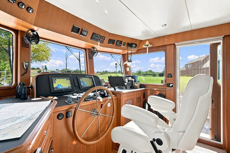 Slide: The Image of Interior of 2015 North Pacific NP49 yacht with navigation equipment and captain's chair. - 14