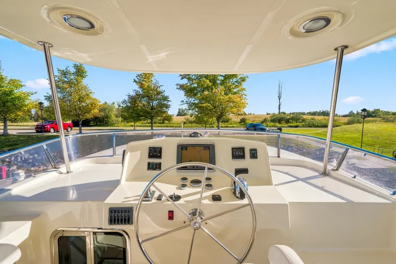 Slide: The Image of Helm of 2015 North Pacific NP49 yacht with steering wheel and navigation instruments. - 40