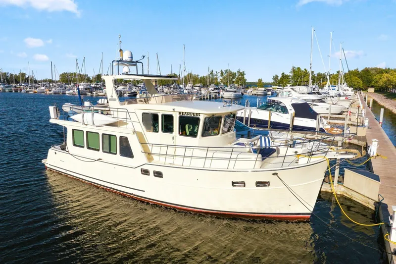 Slide: The Image of 2015 North Pacific NP49 yacht docked at marina under clear blue sky. - 2