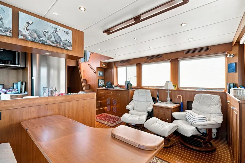 Slide: The Image of Luxurious interior of 2015 North Pacific NP49 yacht with comfortable seating and elegant wood finishes. - 8