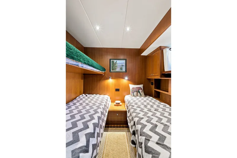 Slide: The Image of Cozy twin cabin with chevron bedding in 2015 North Pacific NP49 yacht. - 26