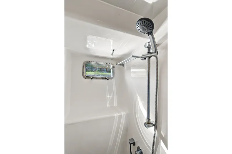 Slide: The Image of Shower area in 2015 North Pacific NP49 yacht with window and adjustable showerhead. - 33