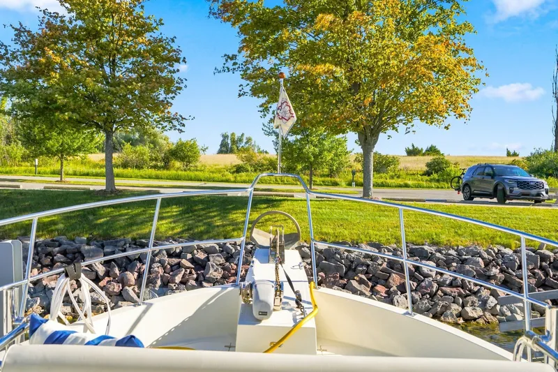 Slide: The Image of Bow view of 2015 North Pacific NP49 yacht docked near a scenic park. - 50