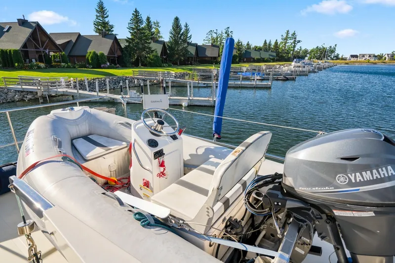 Slide: The Image of 2015 North Pacific NP49 yacht with Yamaha motor docked by lakeside homes. - 44