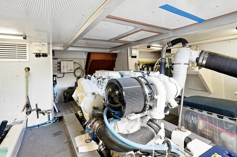 Slide: The Image of Engine room of a 2015 North Pacific NP49 yacht, showcasing machinery and equipment. - 55