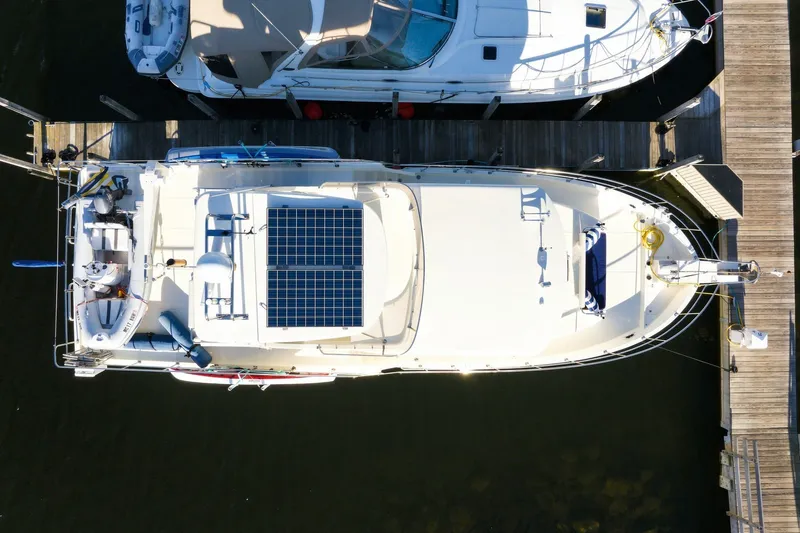 Slide: The Image of Overhead view of a 2015 North Pacific NP49 yacht docked, featuring solar panels. - 59