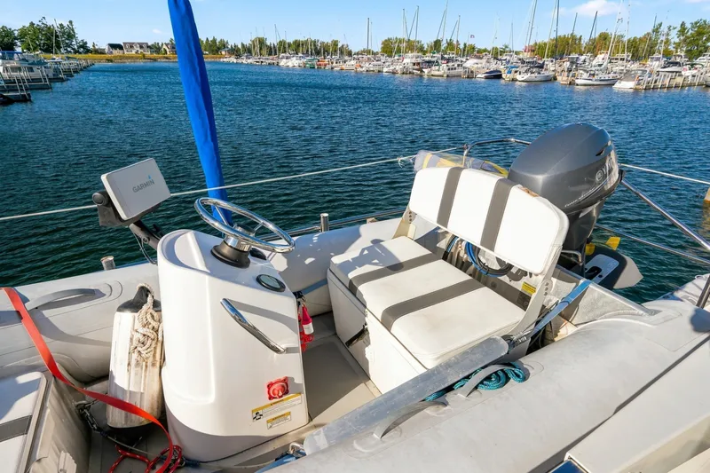 Slide: The Image of 2015 North Pacific NP49 boat helm with Garmin navigation, docked in a marina. - 45