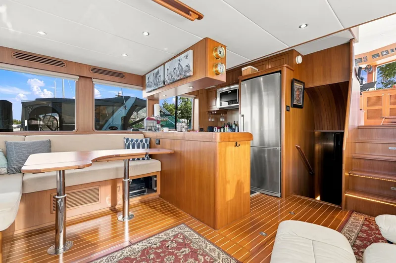 Slide: The Image of Luxurious 2015 North Pacific NP49 yacht interior with wood finishes and modern amenities. - 6