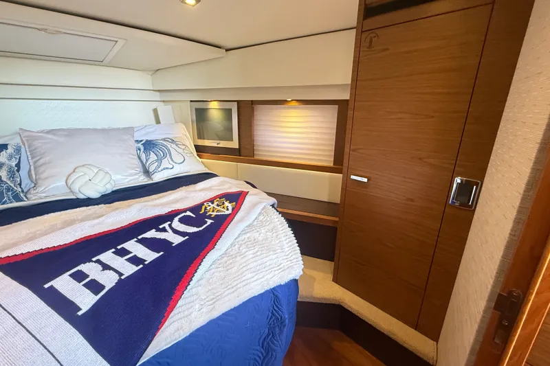 Slide: The Image of Luxurious cabin interior of 2015 Tiara Yachts C44 Coupe with cozy bedding. - 26