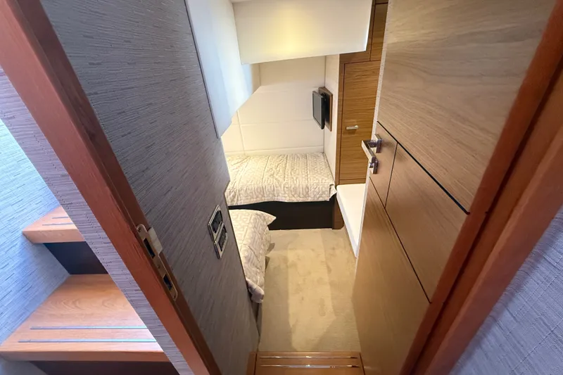 Slide: The Image of Interior cabin of 2015 Tiara Yachts C44 Coupe with cozy bed and wooden accents. - 21