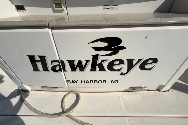 Slide: The Image of 2015 Tiara Yachts C44 Coupe named "Hawkeye" docked in Bay Harbor, MI. - 49
