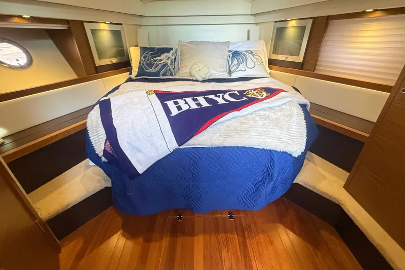 Slide: The Image of Luxurious bedroom interior of 2015 Tiara Yachts C44 Coupe with nautical decor. - 29