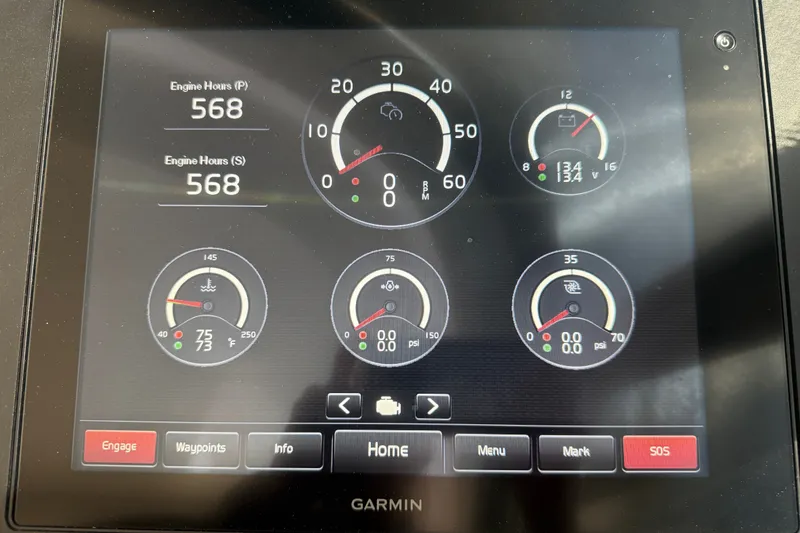 Slide: The Image of Garmin display showing engine metrics on 2015 Tiara Yachts C44 Coupe. - 51