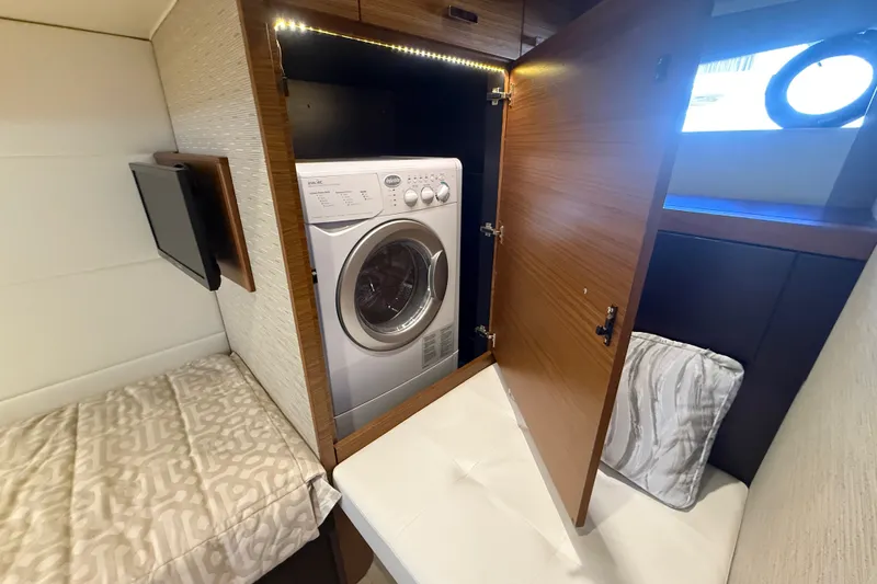 Slide: The Image of Laundry area with washer in 2015 Tiara Yachts C44 Coupe cabin. - 20