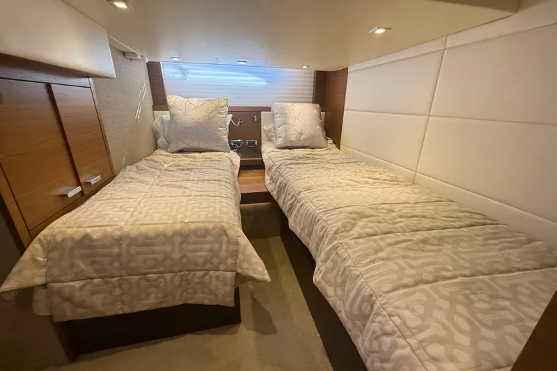 Slide: The Image of Interior cabin of 2015 Tiara Yachts C44 Coupe with twin beds and modern decor. - 22