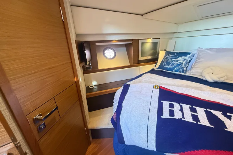 Slide: The Image of Luxurious cabin interior of 2015 Tiara Yachts C44 Coupe with nautical decor. - 25