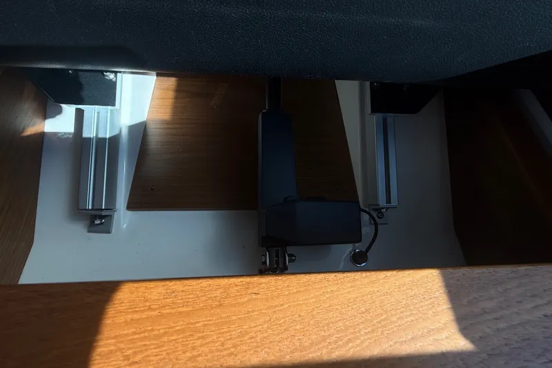 Slide: The Image of Interior detail of a 2015 Tiara Yachts C44 Coupe, showcasing sleek wood and metal components. - 30