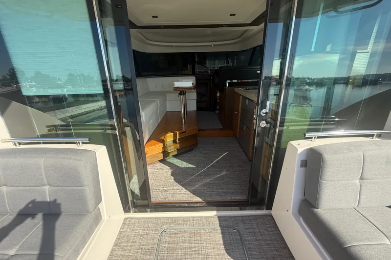 Slide: The Image of Interior view of 2015 Tiara Yachts C44 Coupe, featuring elegant seating and modern design. - 39