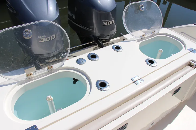 Slide: The Image of 2015 Cobia 296 Center Console with Yamaha 300 engines and dual livewells. - 19