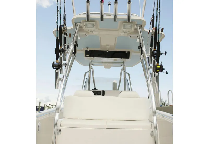 Slide: The Image of Manufacturer Provided Image: 2015 Cobia 296 Center Console boat with fishing rods and seating. - 29