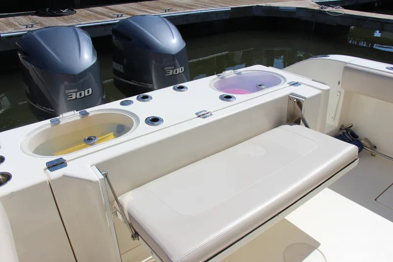 Slide: The Image of 2015 Cobia 296 Center Console boat with Yamaha 300 engines and livewell. - 18
