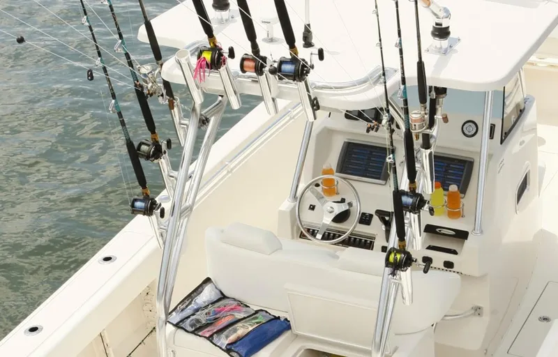 Slide: The Image of Manufacturer Provided Image: 2015 Cobia 296 Center Console boat with fishing rods and gear. - 30