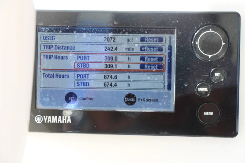 Slide: The Image of Yamaha display showing trip and total hours for a 2015 Cobia 296 Center Console. - 27