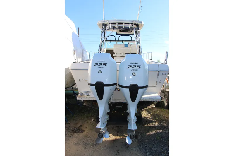 Slide: The Image of 1996 Pro-Line 2950 Walkaround boat with dual Honda 225 VTEC outboard engines. - 15