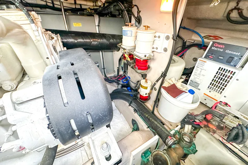 Slide: The Image of Engine room of 2006 Sea Ray 48 Sundancer with Onan marine generator and fuel filters. - 83