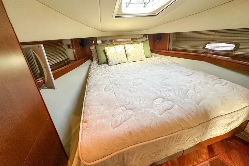 Slide: The Image of Luxurious bedroom interior of 2006 Sea Ray 48 Sundancer yacht with elegant bedding. - 71