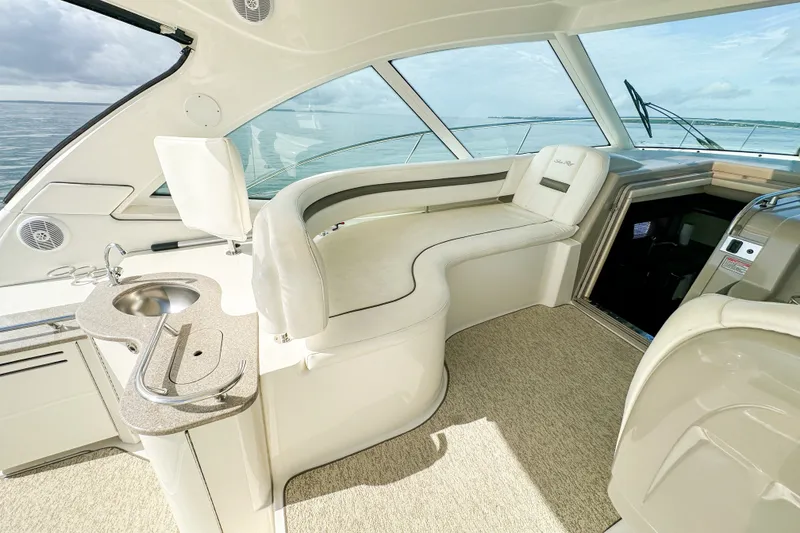 Slide: The Image of Luxurious interior of 2006 Sea Ray 48 Sundancer yacht with plush seating and sleek design. - 48