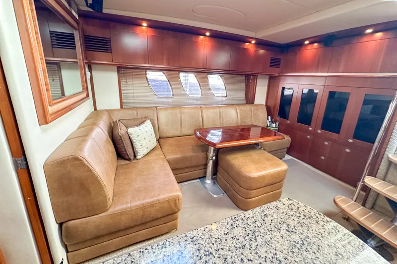 Slide: The Image of Luxurious interior of 2006 Sea Ray 48 Sundancer yacht with plush seating and elegant wood finishes. - 65