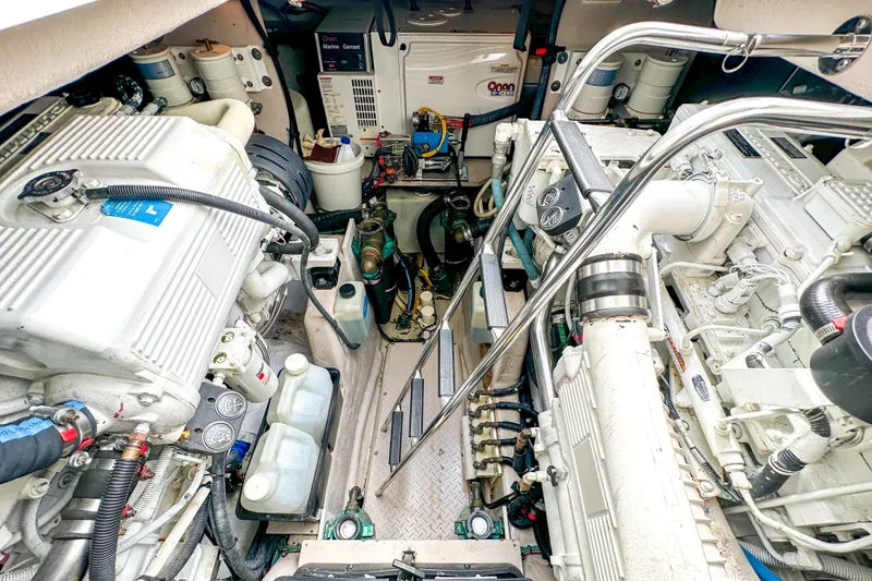 Slide: The Image of Engine room of 2006 Sea Ray 48 Sundancer yacht, showcasing mechanical components and systems. - 88