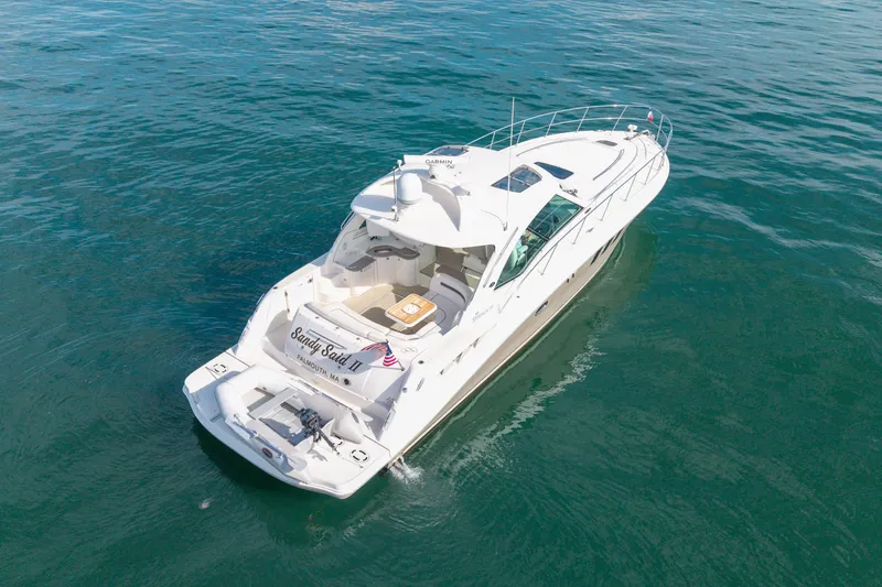Slide: The Image of 2006 Sea Ray 48 Sundancer yacht on open water, aerial view. - 26