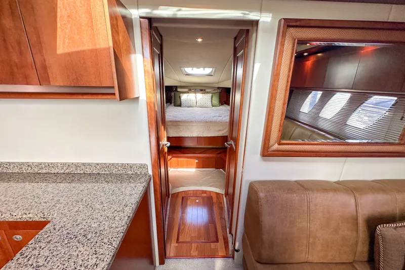 Slide: The Image of Interior of 2006 Sea Ray 48 Sundancer yacht with cozy bedroom and elegant wood finishes. - 68