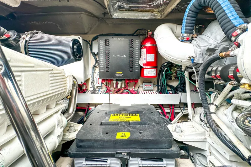 Slide: The Image of Engine room of 2006 Sea Ray 48 Sundancer with visible components and wiring. - 81
